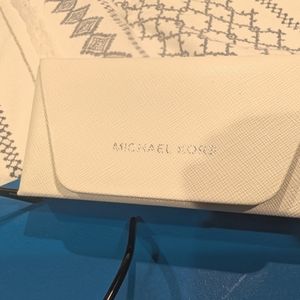 Designer Eyeglasses with it's original case and cloth with plastic, brand new.